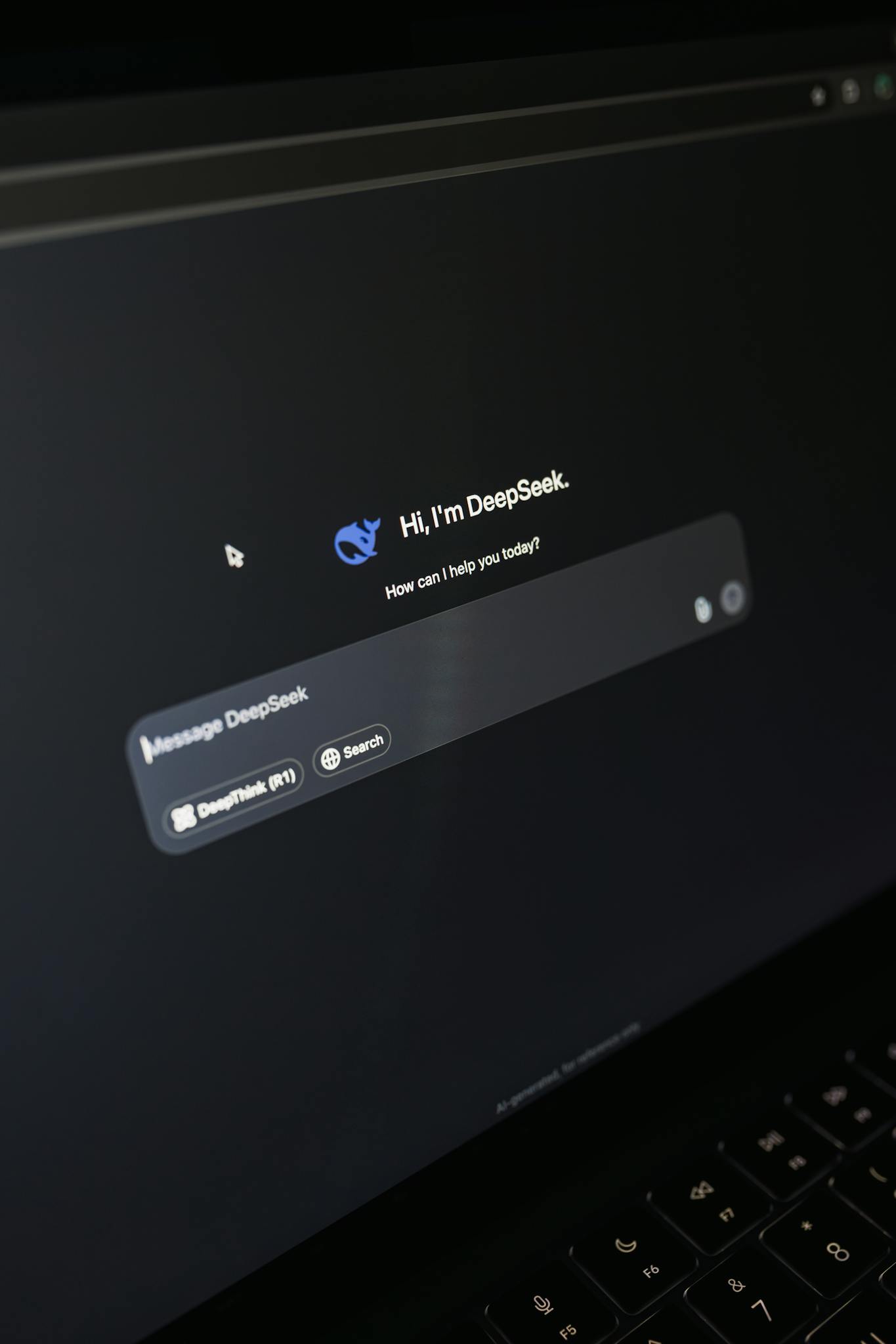 Close-up of a laptop screen displaying an AI chatbot interface with a dark theme.